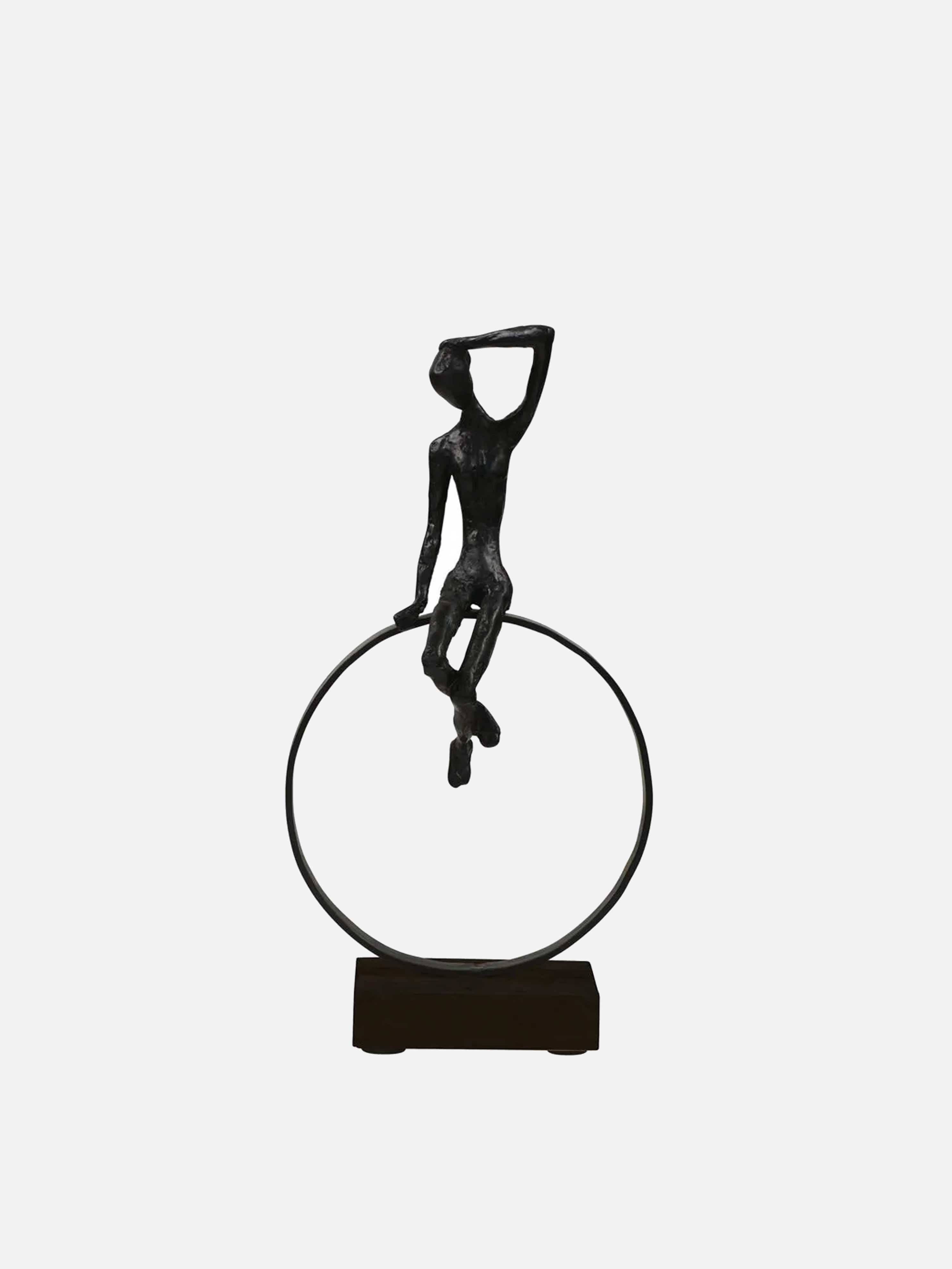Sitting Figure on Black Ring